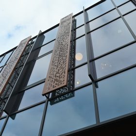 facade,of,a,modern,glass,building,with,vertical,strips,of